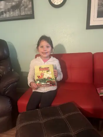 Stella holding the book